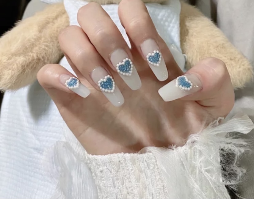 Blue & White Heart Shape nails With Stones In Long Coffin shape.